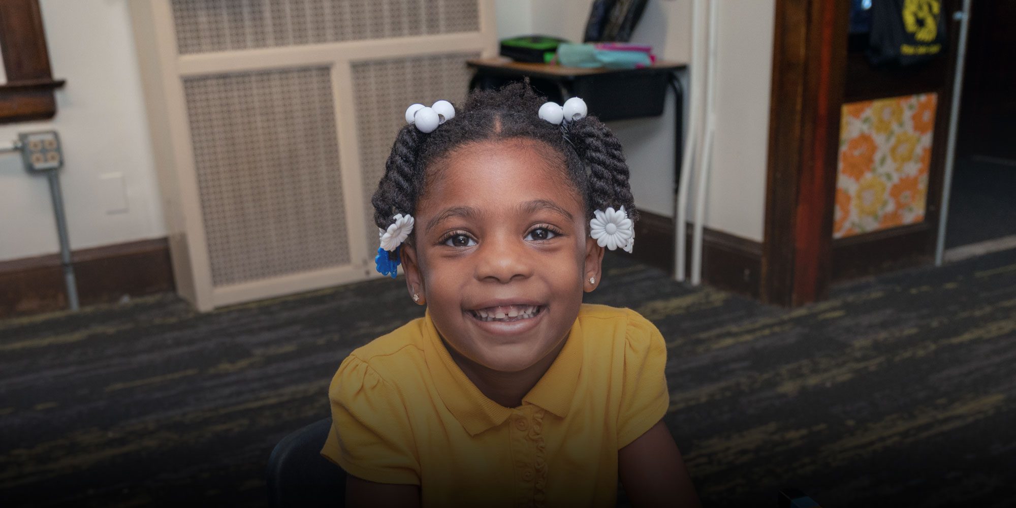 Smiling student at desk